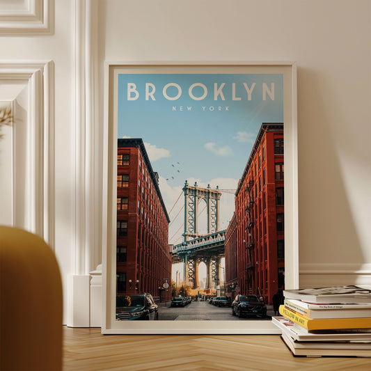 A framed poster of the Manhattan Bridge in New York City, with the text "BROOKLYN NEW YORK" prominently displayed.