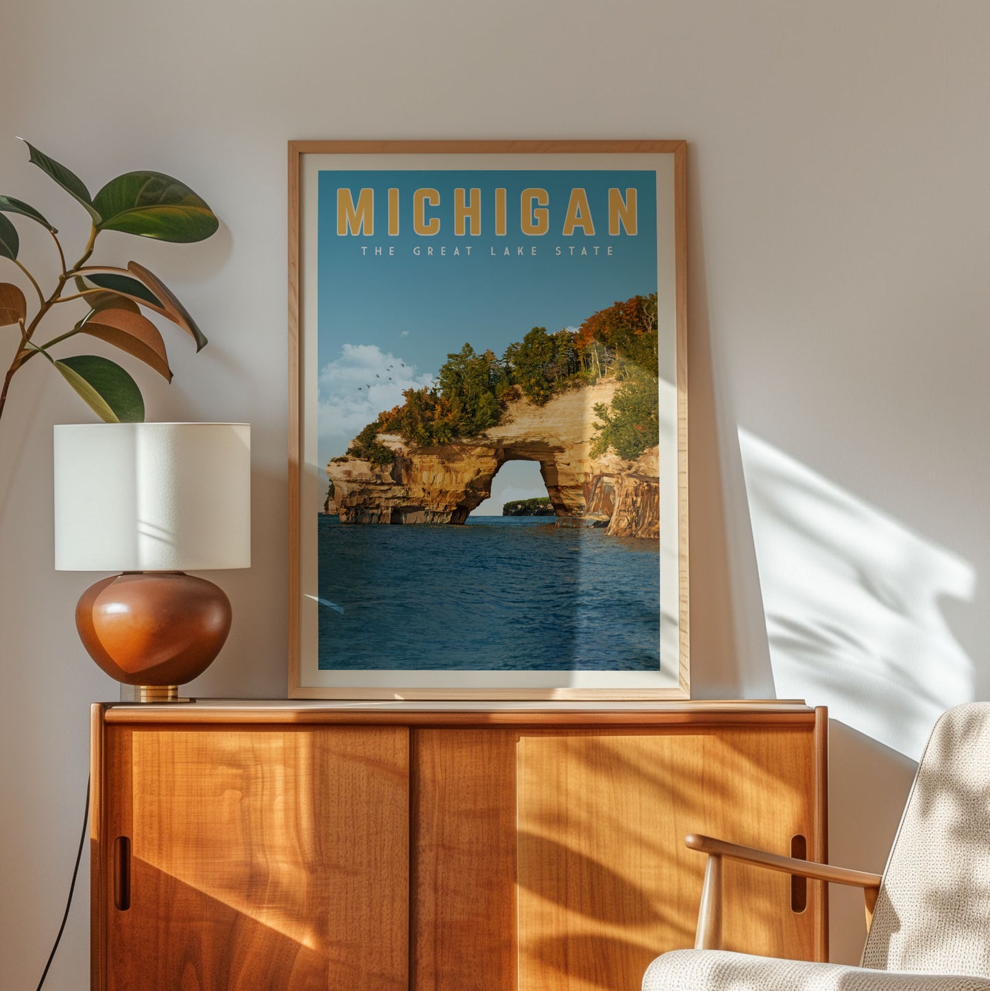 a framed poster of the Great Lakes State, with a scenic view of the lake and surrounding landscape.