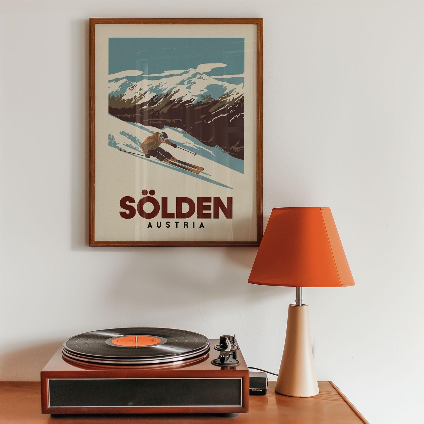 a record player sitting on top of a wooden table