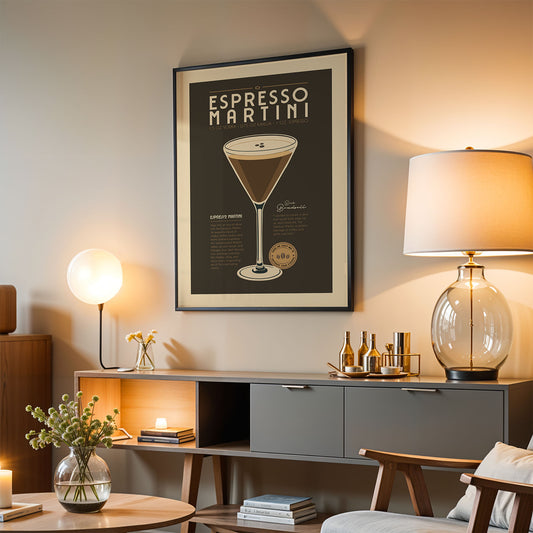 a living room with a framed poster of an espresso martini hanging on the wall, a wooden sideboard with various items, and a lamp on a table.