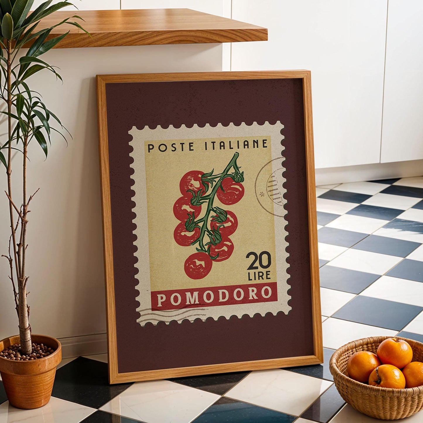 a potted plant sitting next to a framed poster