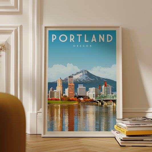 A framed poster of the Portland skyline, featuring the city's iconic landmarks and a mountain in the background.
