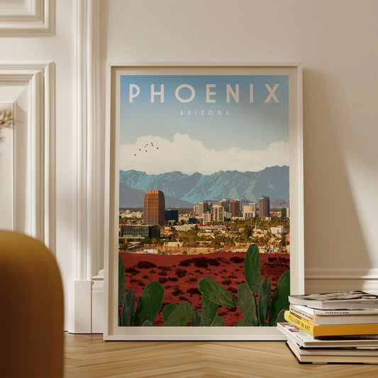 A framed poster of Phoenix, Arizona, depicting the city's skyline and mountains in the background.