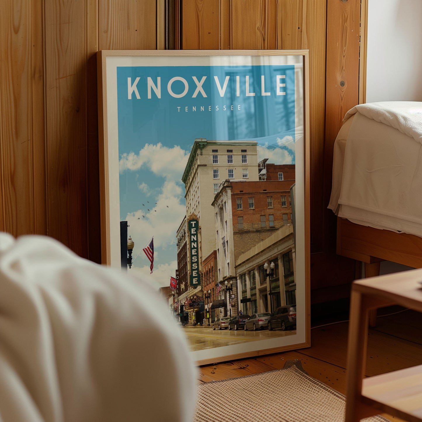 A framed poster of Knoxville, Tennessee, depicting the city's skyline and architecture.