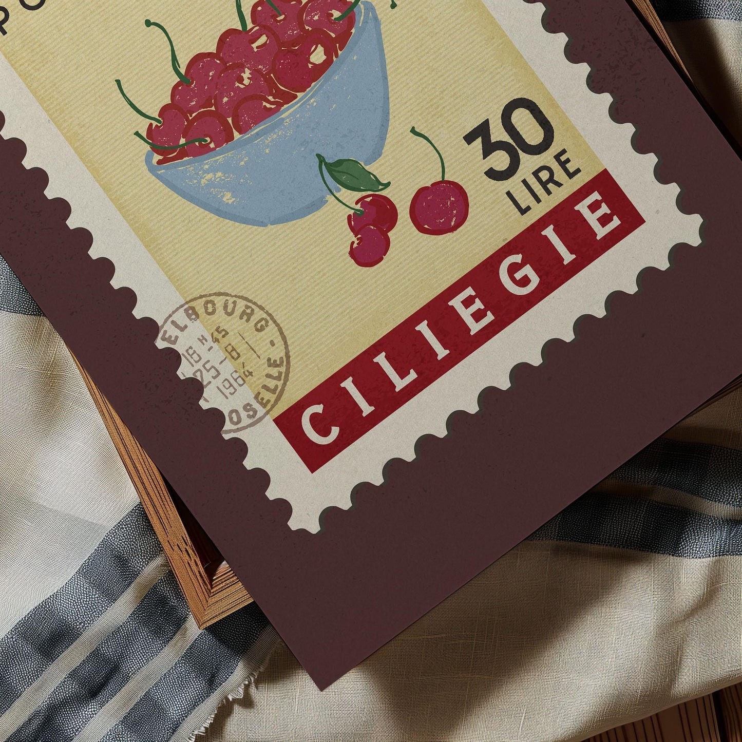 A close-up of a postage stamp featuring a bowl of cherries, with the text "CILIEGIE" and "30 LIRRE" printed on it.