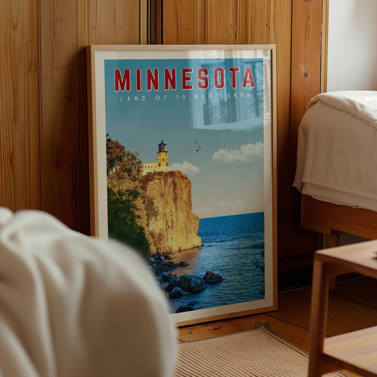 A framed poster of a scenic coastal landscape in Minnesota, featuring a lighthouse on a cliff overlooking the ocean.
