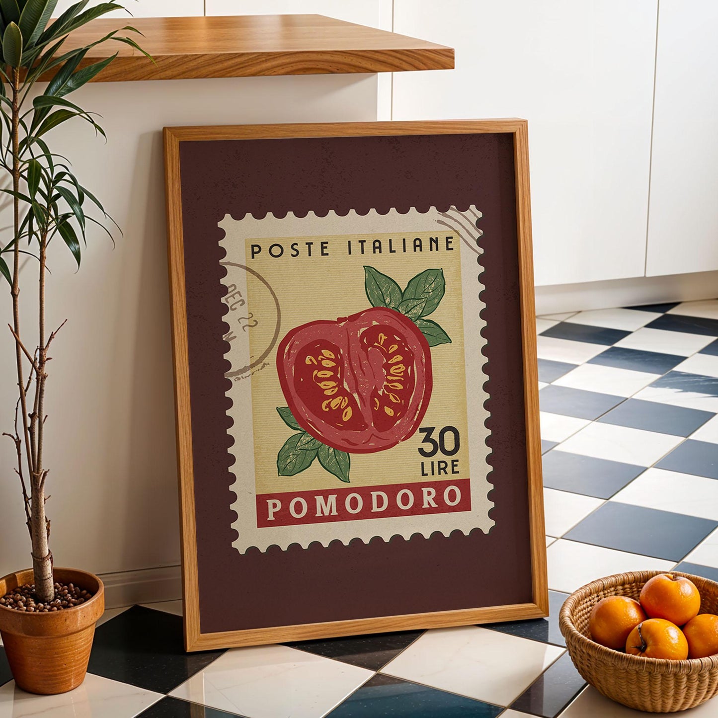 a potted plant sitting next to a framed stamp