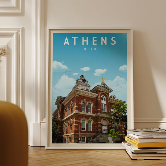 A framed poster of a historic building in Athens, Ohio, with a clear blue sky in the background.