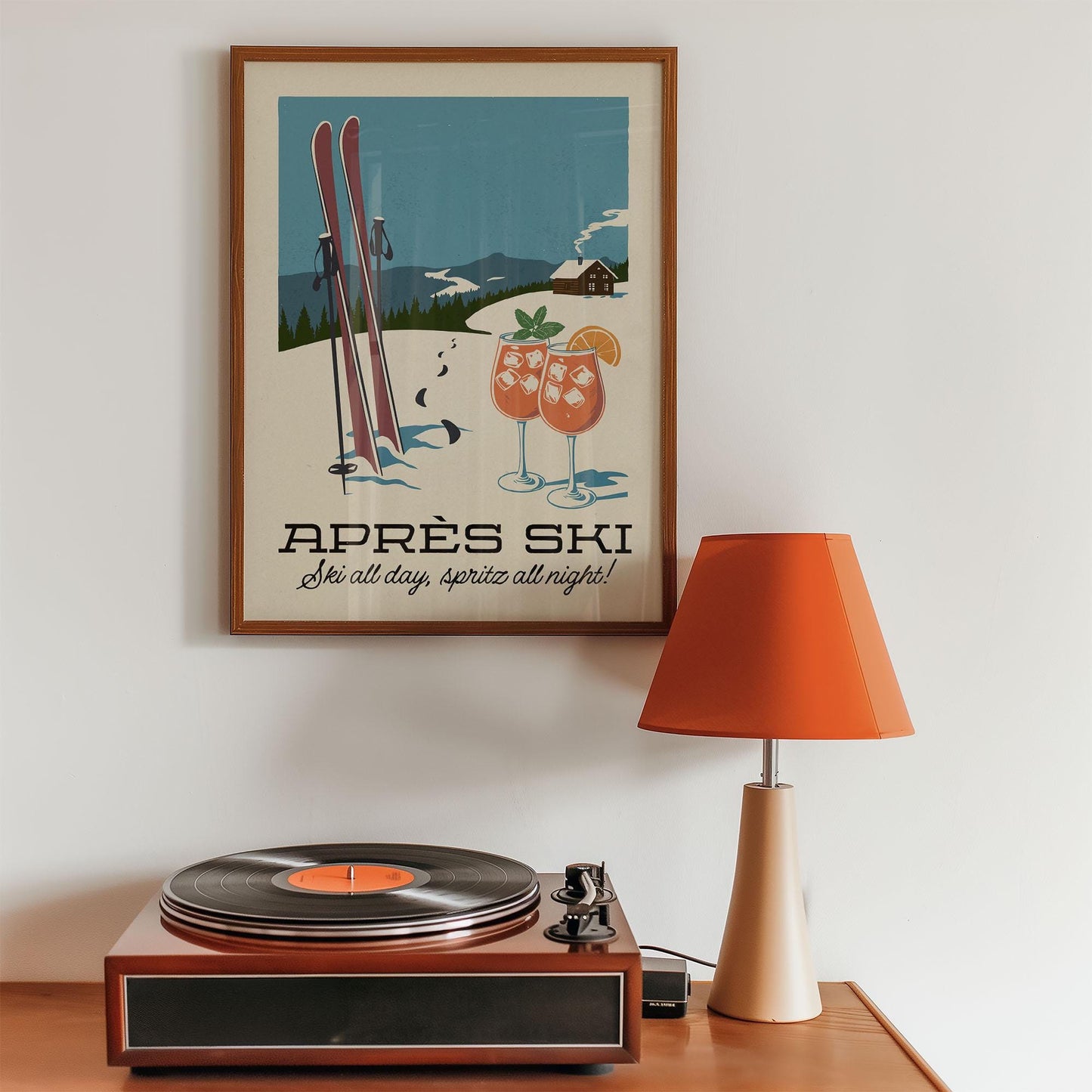 a record player sitting on top of a wooden table
