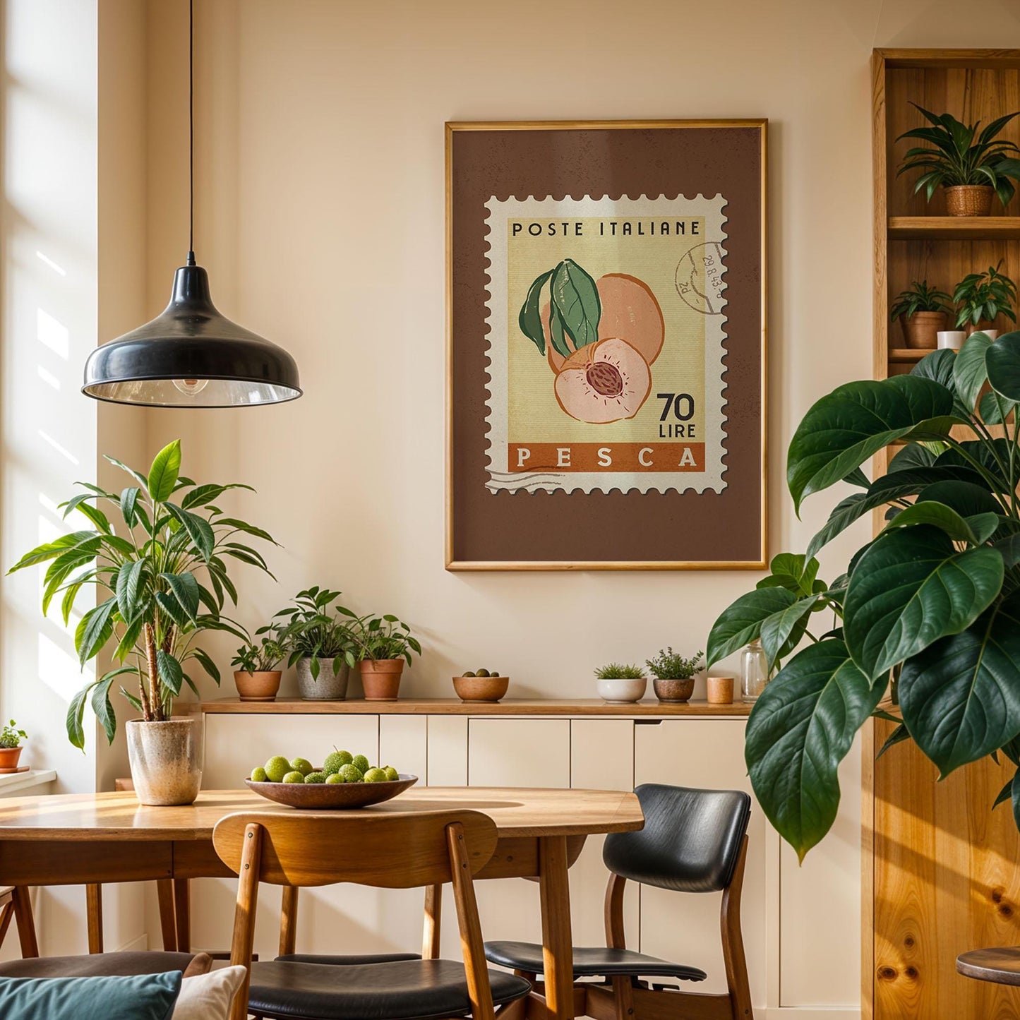 a cozy dining area with a wooden table, chairs, and a potted plant. A framed stamp with a peach and the text "POSTE ITALIERE 70 LIRE PESCA" hangs on the wall above the table.