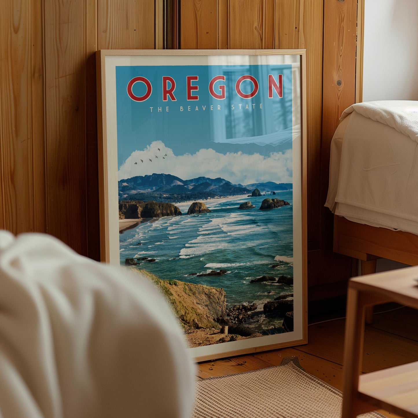 A framed poster of the scenic Oregon coastline, featuring a picturesque view of the ocean, mountains, and coastal features.