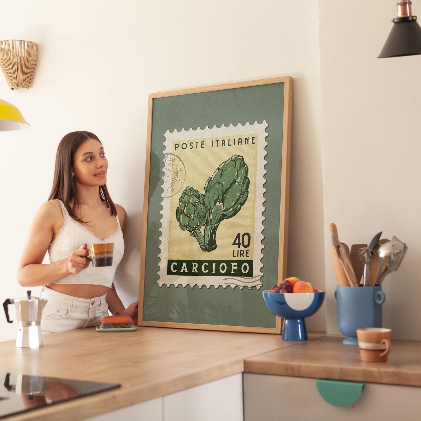 a woman standing in a kitchen next to a poster