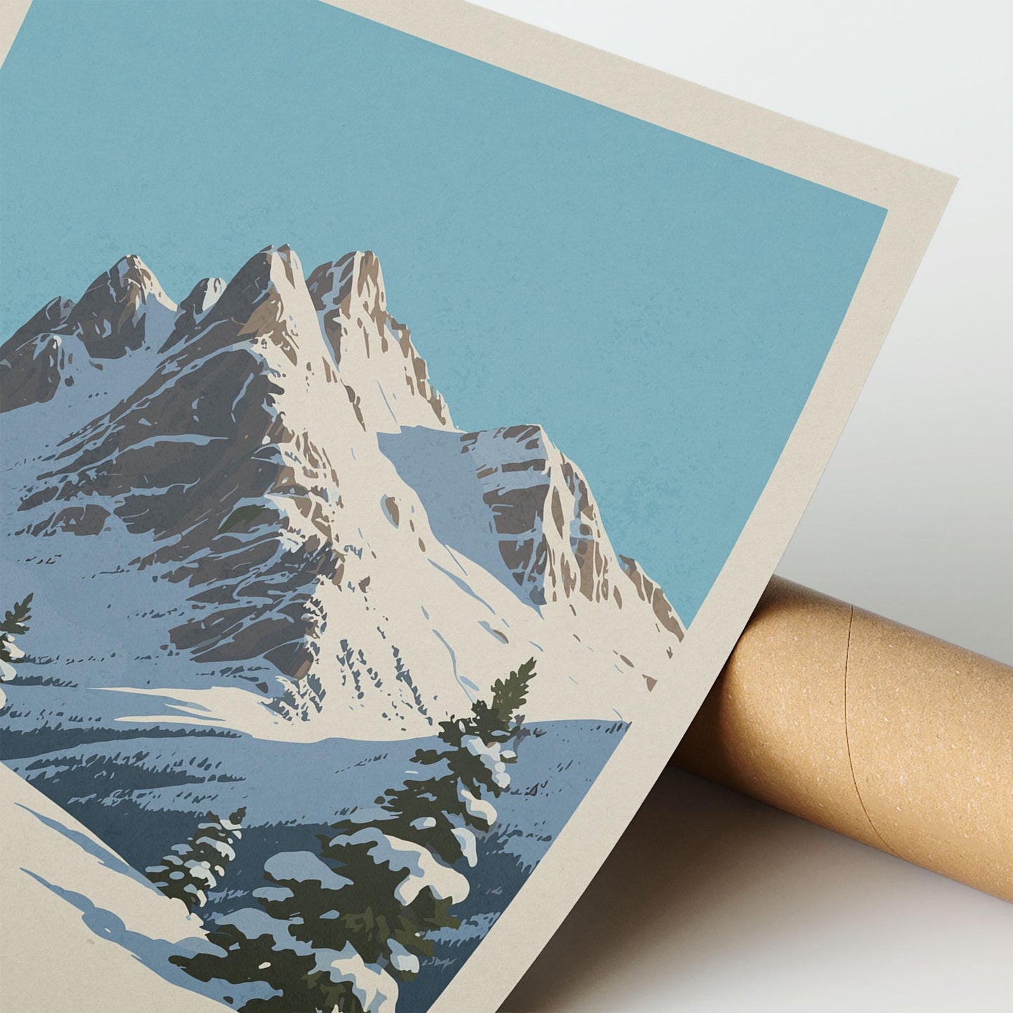 A close-up of a framed print depicting a snowy mountain landscape with a clear blue sky.