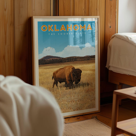 a framed poster of a buffalo in a field, with the text "OKLAHOMA THE SOONER STATE" prominently displayed.