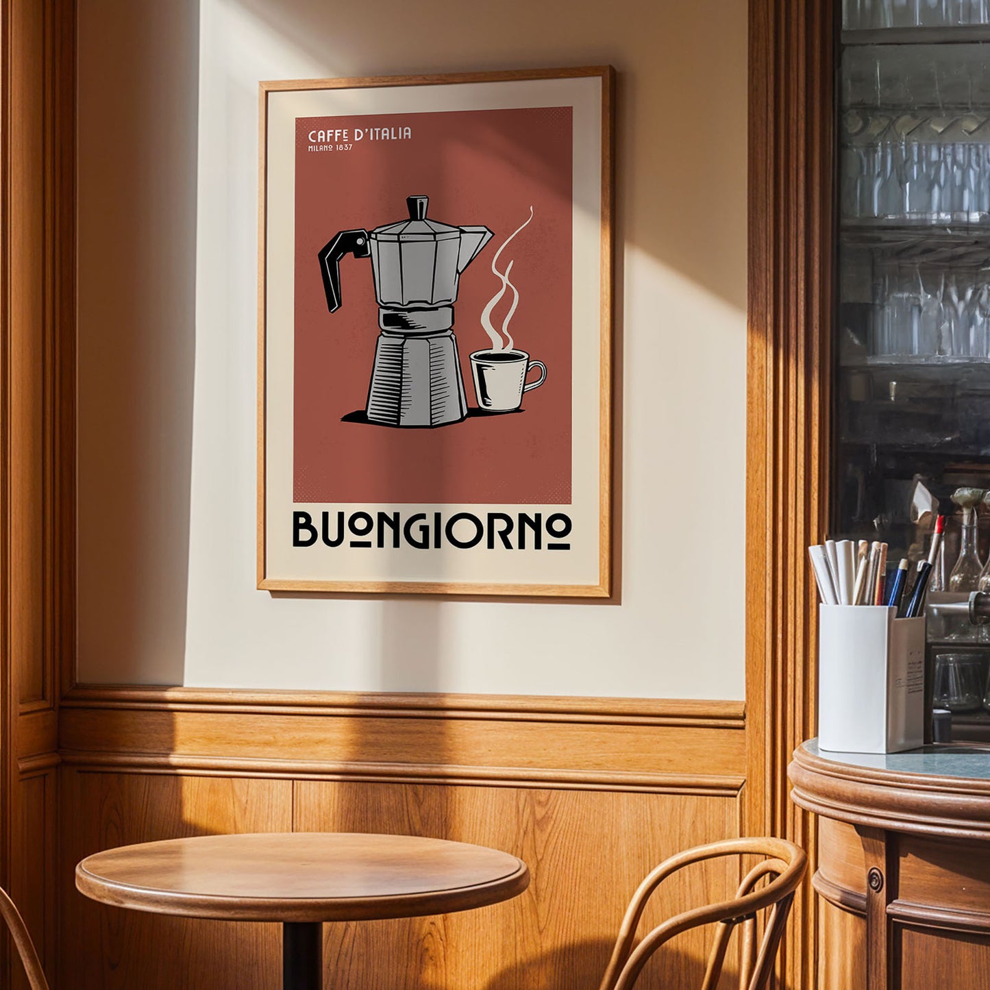 a framed poster of a coffee maker and a cup of coffee on a wall, with the text "Buongiorno" below the poster.