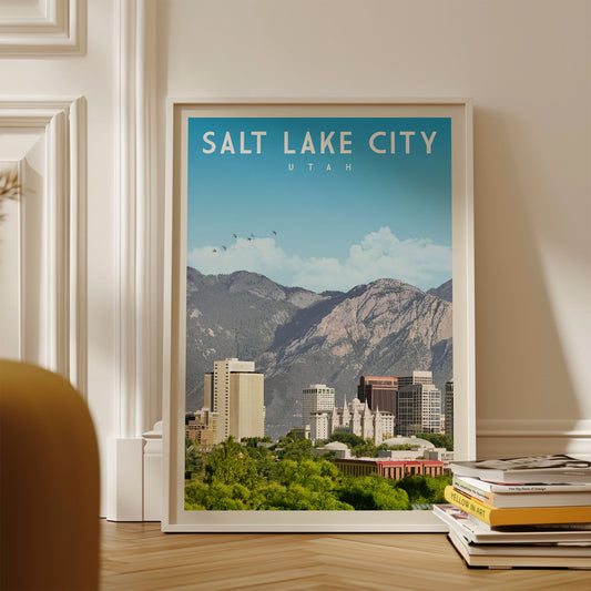 A framed poster of Salt Lake City, Utah, with a mountainous landscape in the background and a city skyline visible.