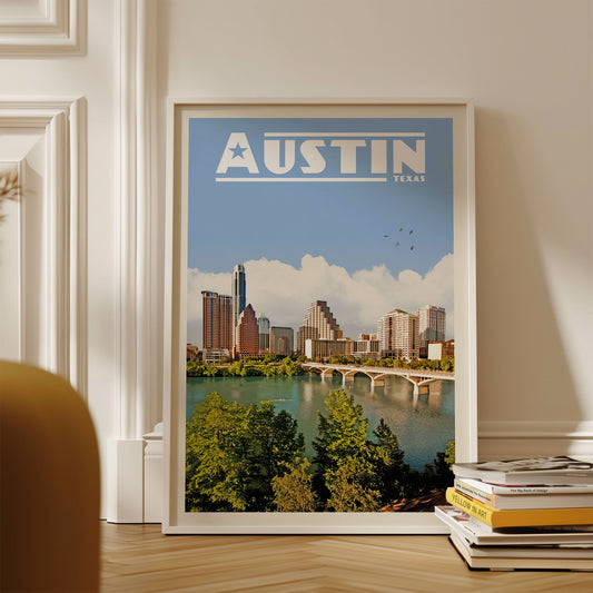 A framed poster of the Austin skyline, with the city's iconic buildings and a river in the foreground.