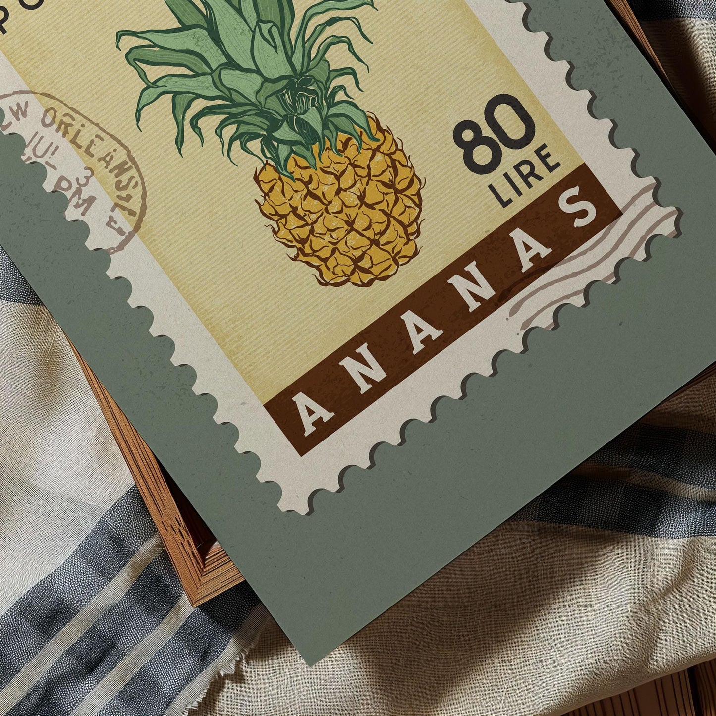 A postage stamp featuring a pineapple illustration, with the text "ANANA" and "80 LIRES" printed on it.