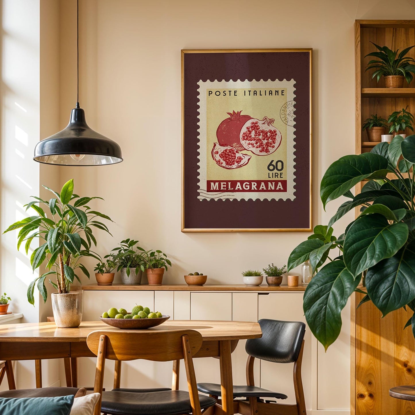 a cozy dining area with a wooden table, chairs, and a potted plant. A framed Italian postage stamp is hanging on the wall above the table, adding a unique touch to the space.