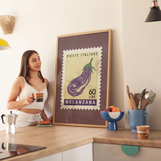 a woman standing in a kitchen next to a poster
