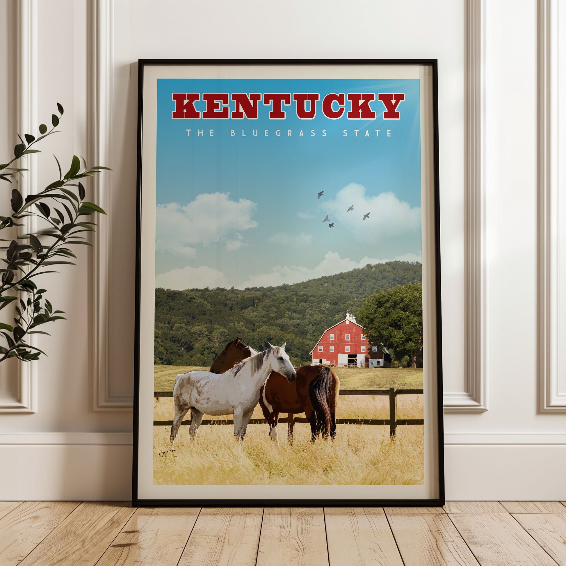 A framed poster of a rural scene in Kentucky, featuring a white horse and a brown horse standing in a field with a red barn in the background.
