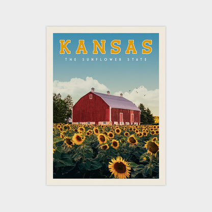 A red barn stands in a field of sunflowers, with a blue sky and fluffy clouds in the background.