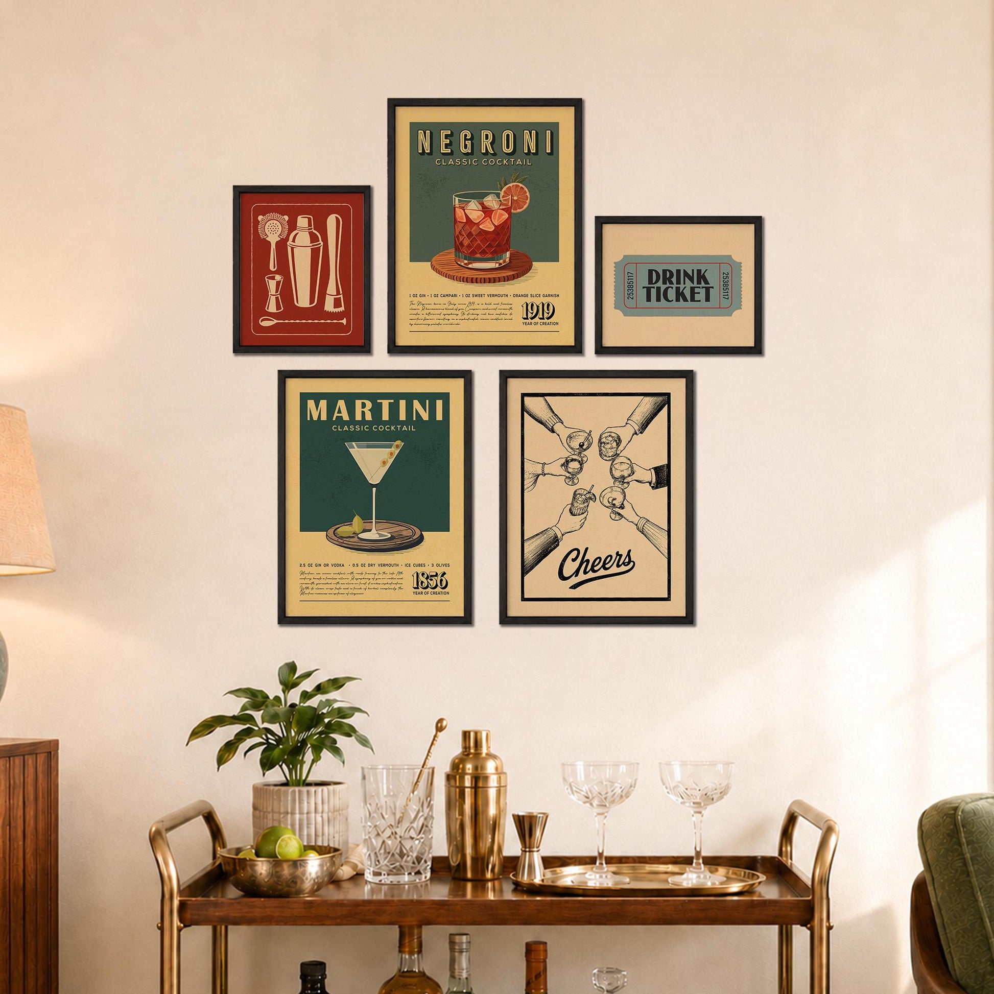 a wall display with framed vintage-style posters and a wooden bar cart with various cocktail-making accessories.