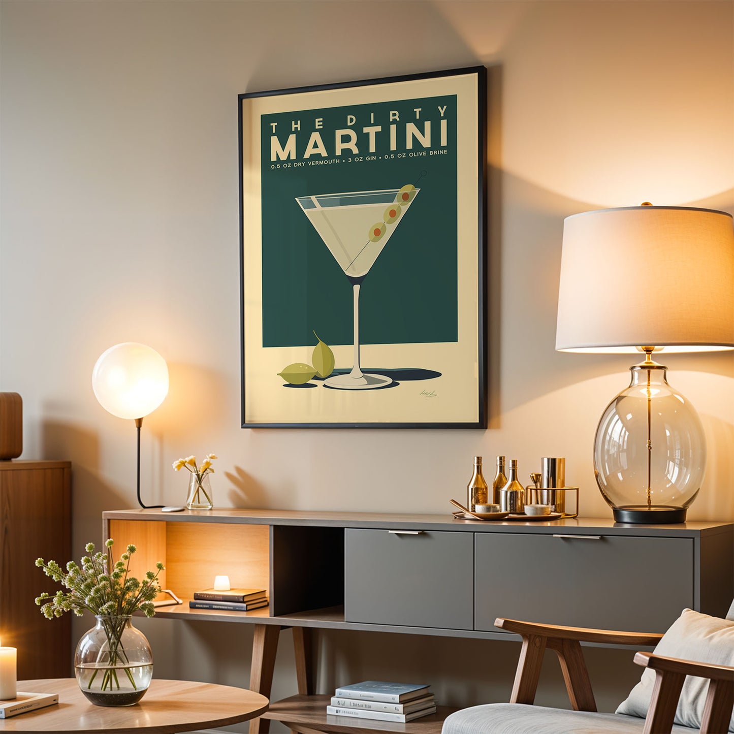 a living room with a framed poster of a martini glass hanging on the wall, a wooden sideboard with various items on it, and a lamp on a table.