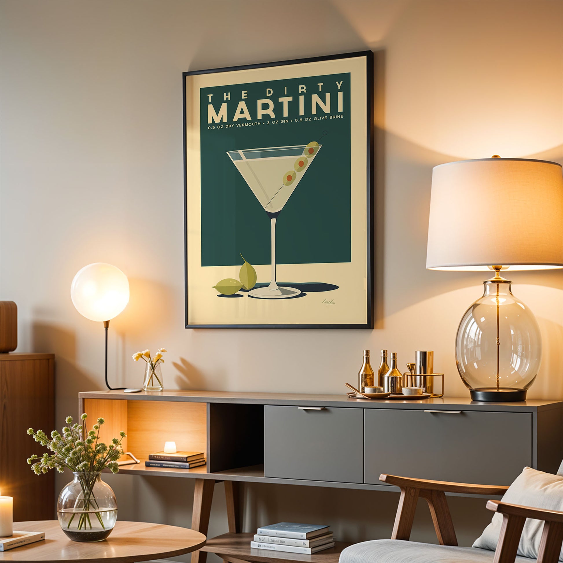 a living room with a framed poster of a martini glass hanging on the wall, a wooden sideboard with various items on it, and a lamp on a table.