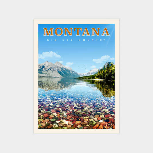 A scenic image of a lake surrounded by mountains, with a rocky shore and a clear blue sky.