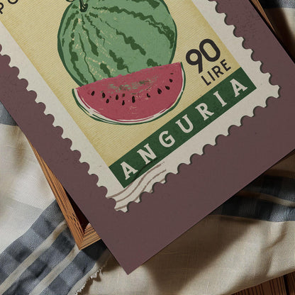 A postage stamp from Anguria, featuring a watermelon illustration and the text &quot;90 Lire&quot;.