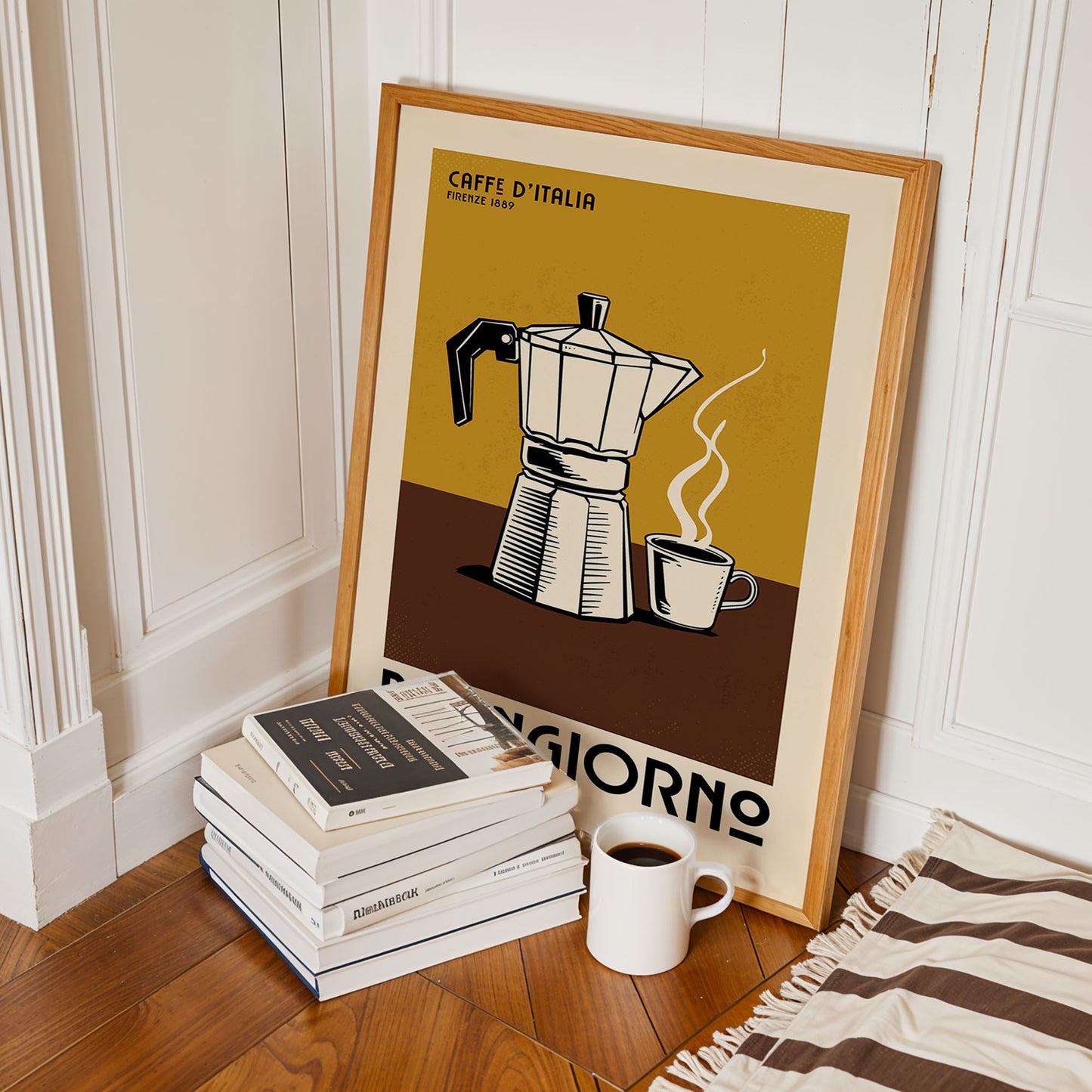 a framed poster of a coffee maker with a stack of books and a cup of coffee on the floor in front of it.