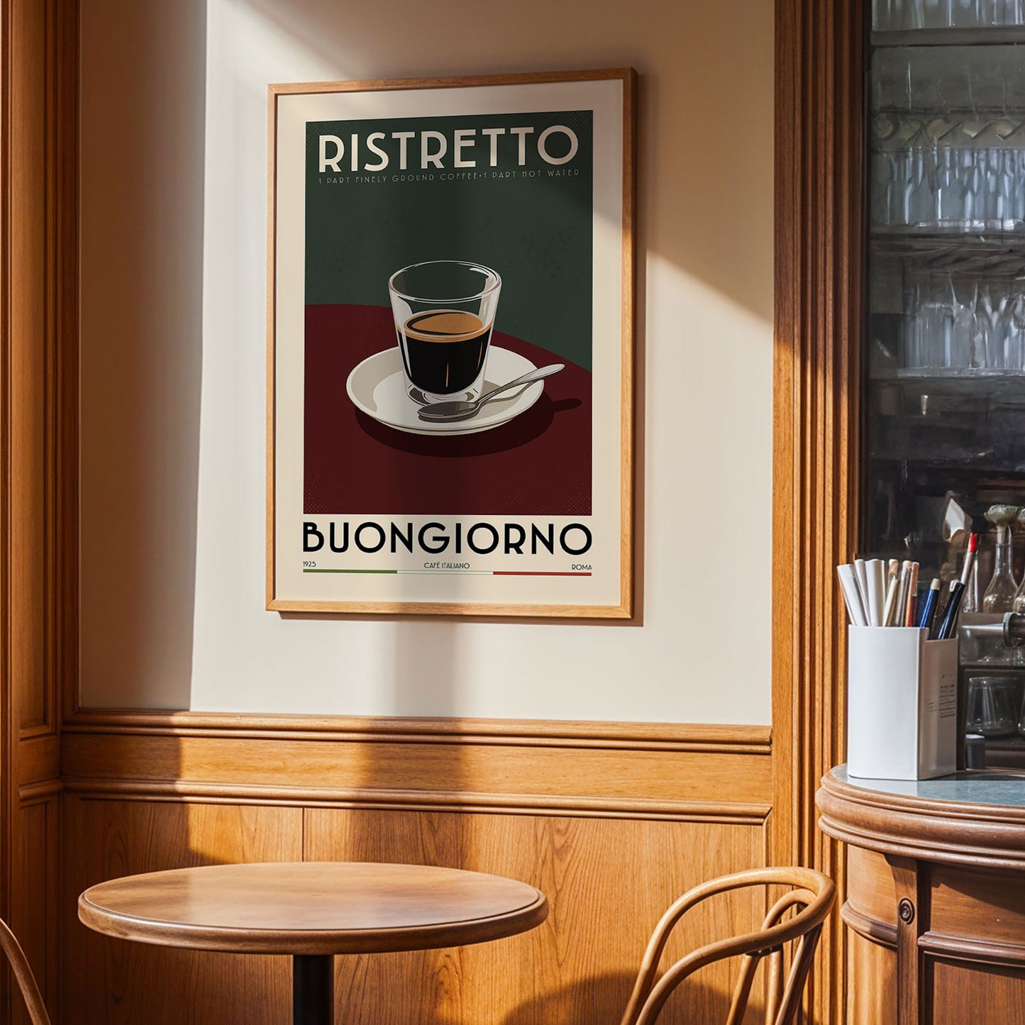 a framed poster of a cup of coffee with the text "RISTRETO BUONGIORNO" on it, hanging on a wall in a cafe setting.