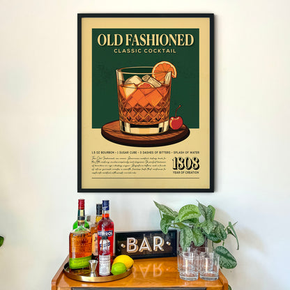 a framed poster of a classic cocktail, with a wooden bar counter below it. The poster displays the text "OLD FASHIONED CLASSIC COCKTAIL" and includes a detailed illustration of the cocktail. The bar counter has various bottles of alcohol and glasses, creating a cozy and inviting atmosphere.