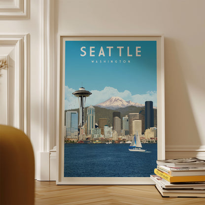 A framed poster of the Seattle skyline, featuring the Space Needle and the city's waterfront, is displayed on a wall.