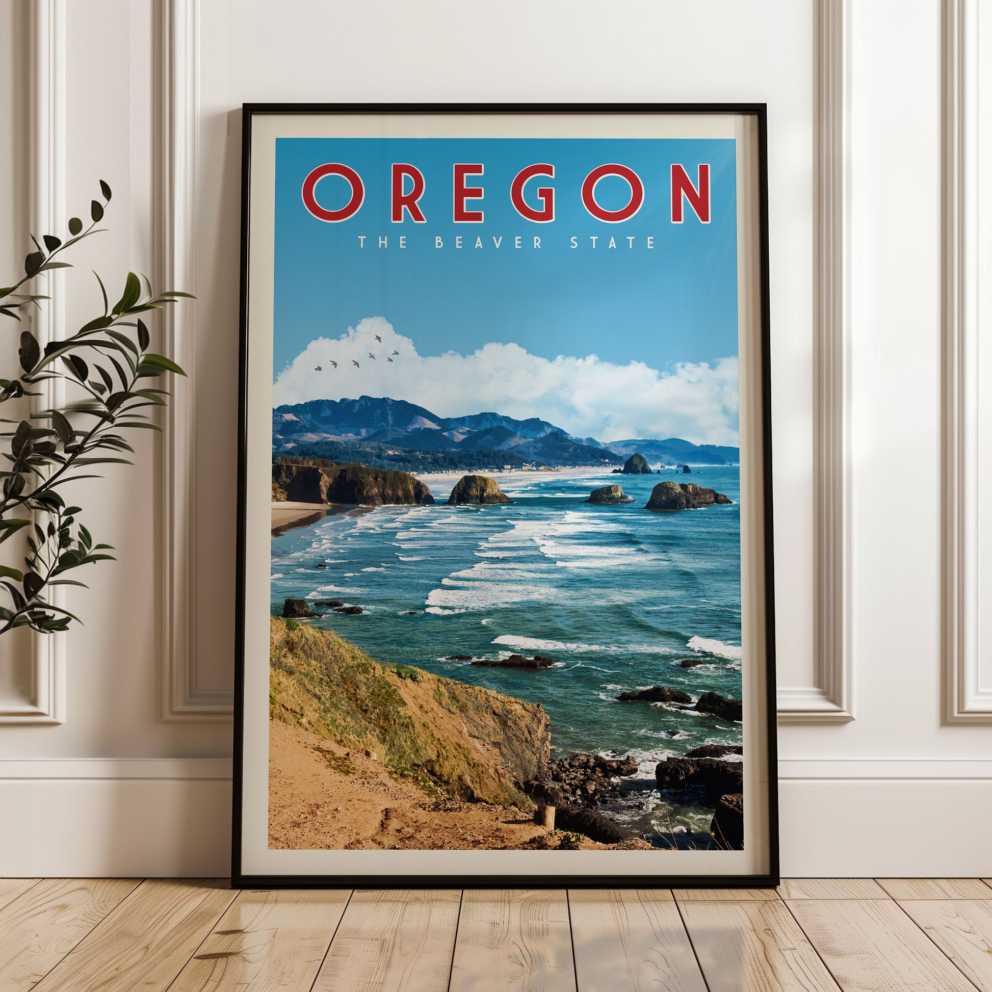 A framed poster of the scenic coastal landscape of Oregon, featuring a beach, mountains, and the ocean.