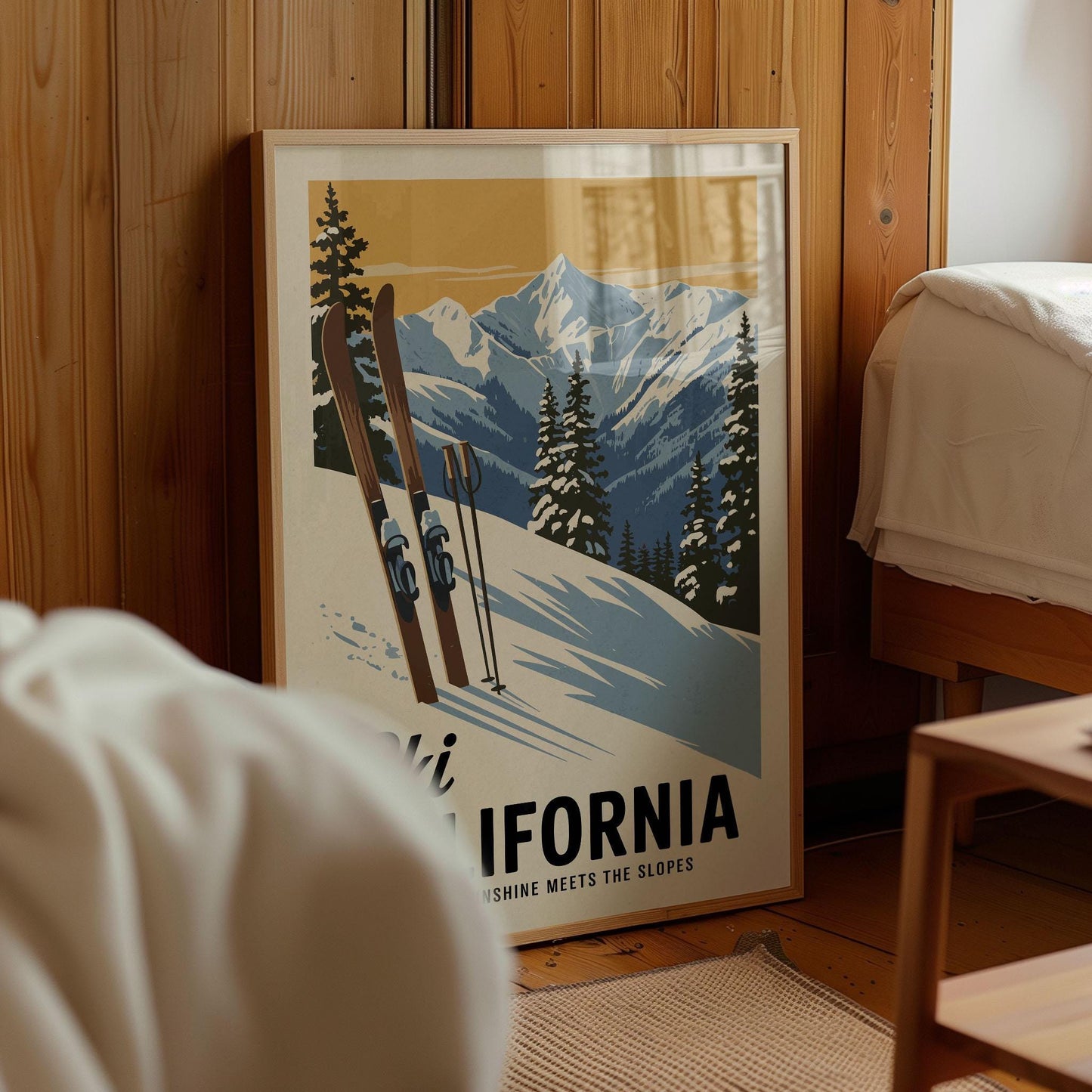A framed poster of a snowy mountain landscape with skis and trees, featuring the text "California meets the slopes" and "Sun shine meets the slopes".