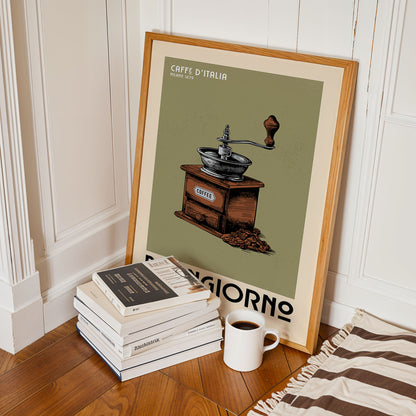 a framed poster of a coffee grinder, a stack of books, and a cup of coffee on a wooden floor.