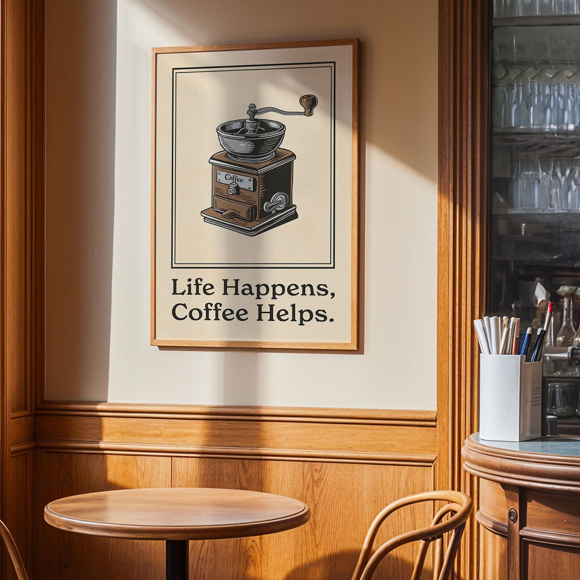 a framed poster with the text "Life Happens, Coffee Helps" hanging on a wall in a coffee shop or cafe setting.