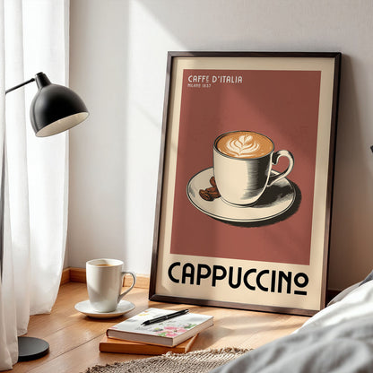a framed poster of a cup of cappuccino, with a lamp and a book on a wooden floor in the foreground.