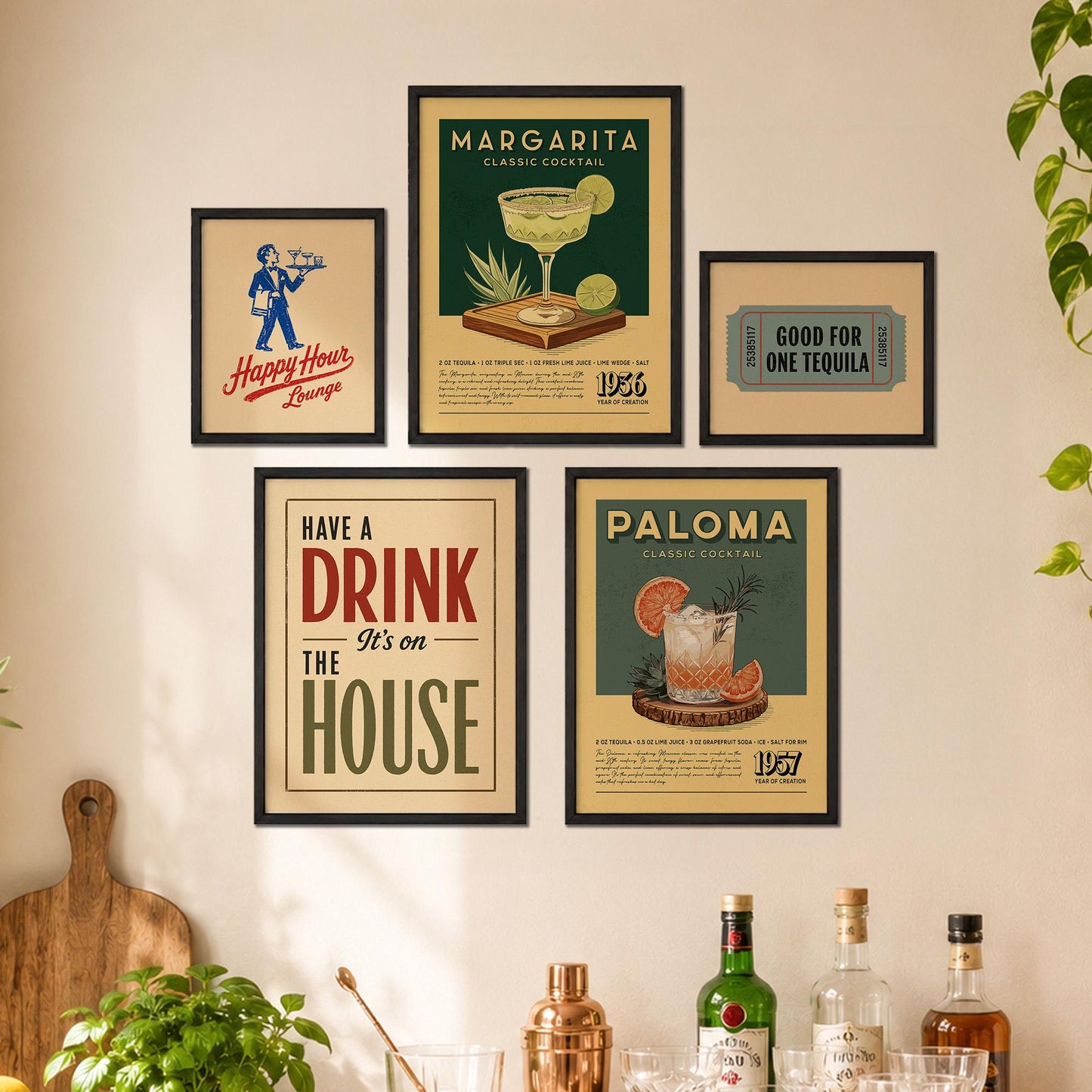 a wall with five framed vintage-style advertisements for margaritas and tequila, along with a wooden cutting board and various bottles of alcohol.