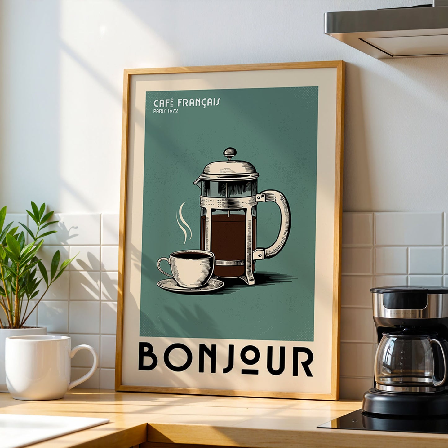 a framed poster of a French press coffee maker and a cup of coffee, with the text "BONJOUR" below the coffee maker.