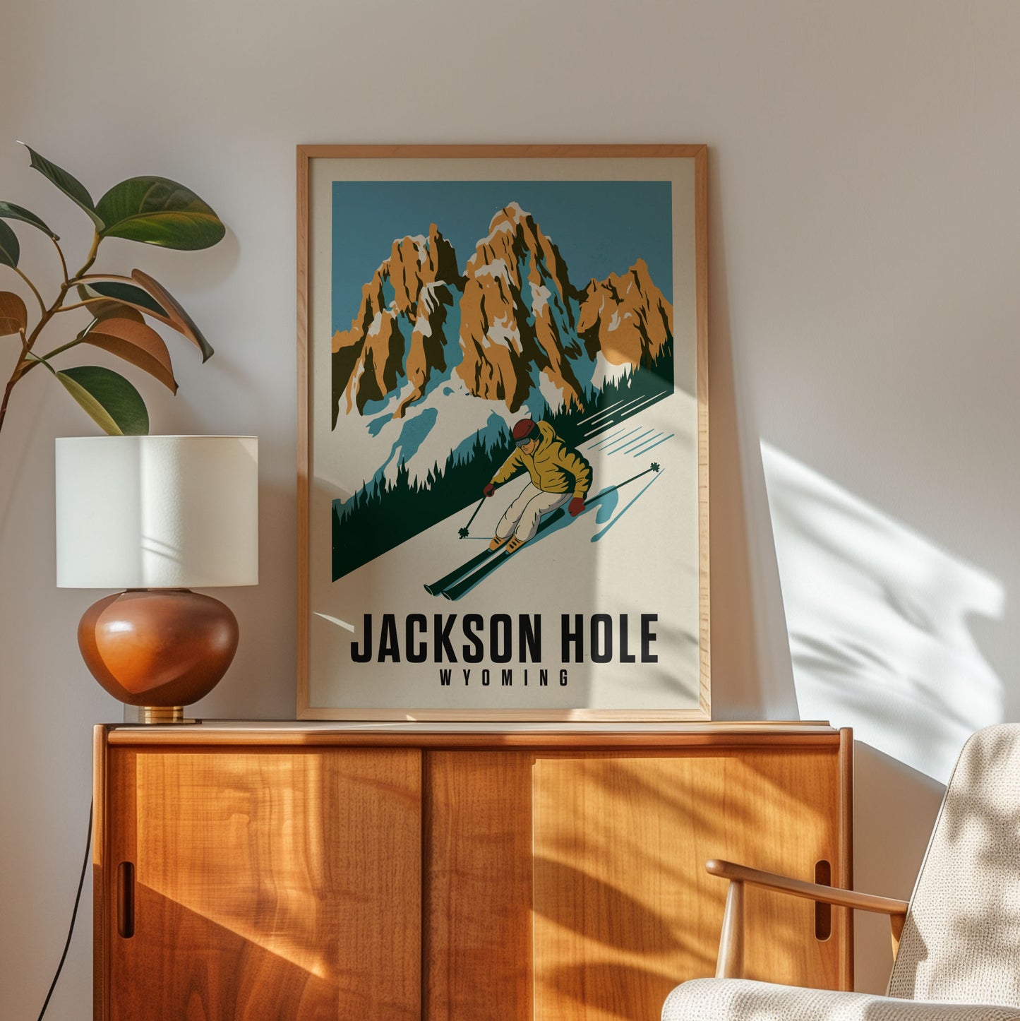 a framed poster of a skier on a mountain slope, with the text "JACKSON HOLE WYOMING" below the illustration.