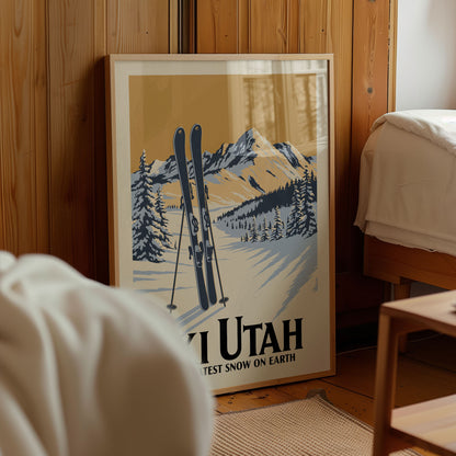 A framed poster of a snowy mountain landscape with skis, featuring the text "YI UTAH" and "TEST SNOW ON EARTH".