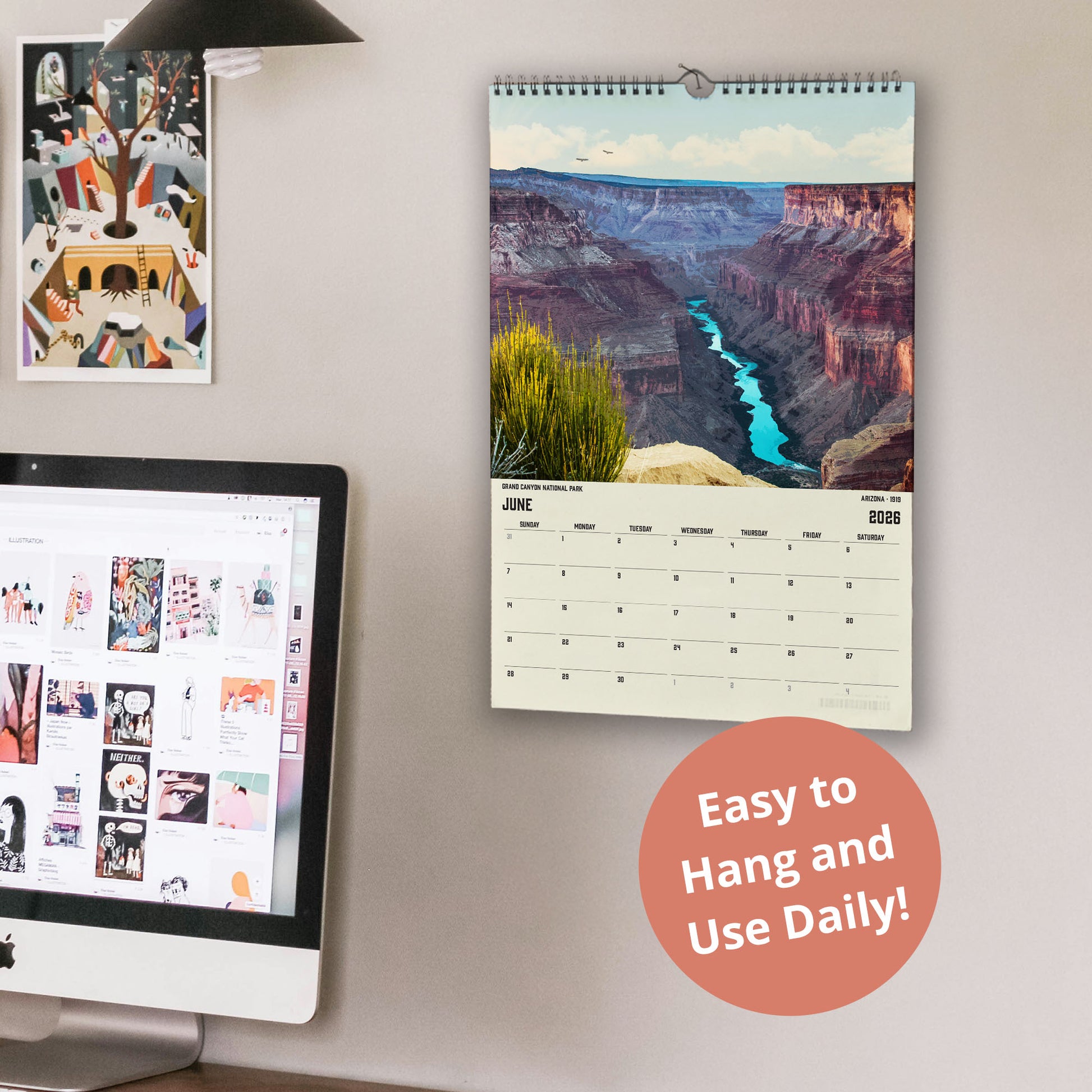 a wall with a calendar and a computer monitor. The calendar displays a scenic image of a canyon, and the computer monitor shows a webpage with various images. There is also a text overlay that reads "Easy to Hang and Use Daily!"