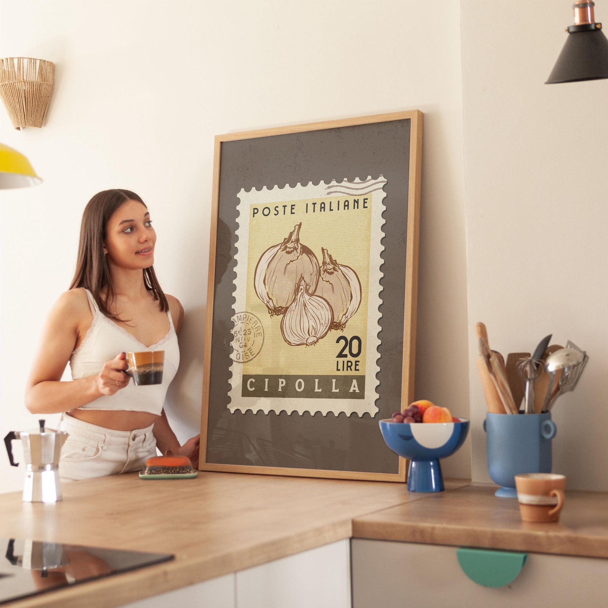 a woman standing in a kitchen next to a poster