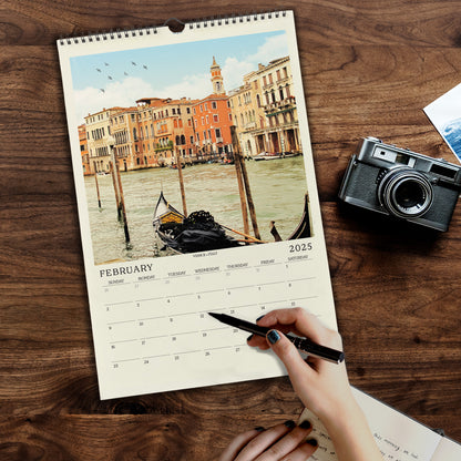 a person holding a pen and writing on a calendar