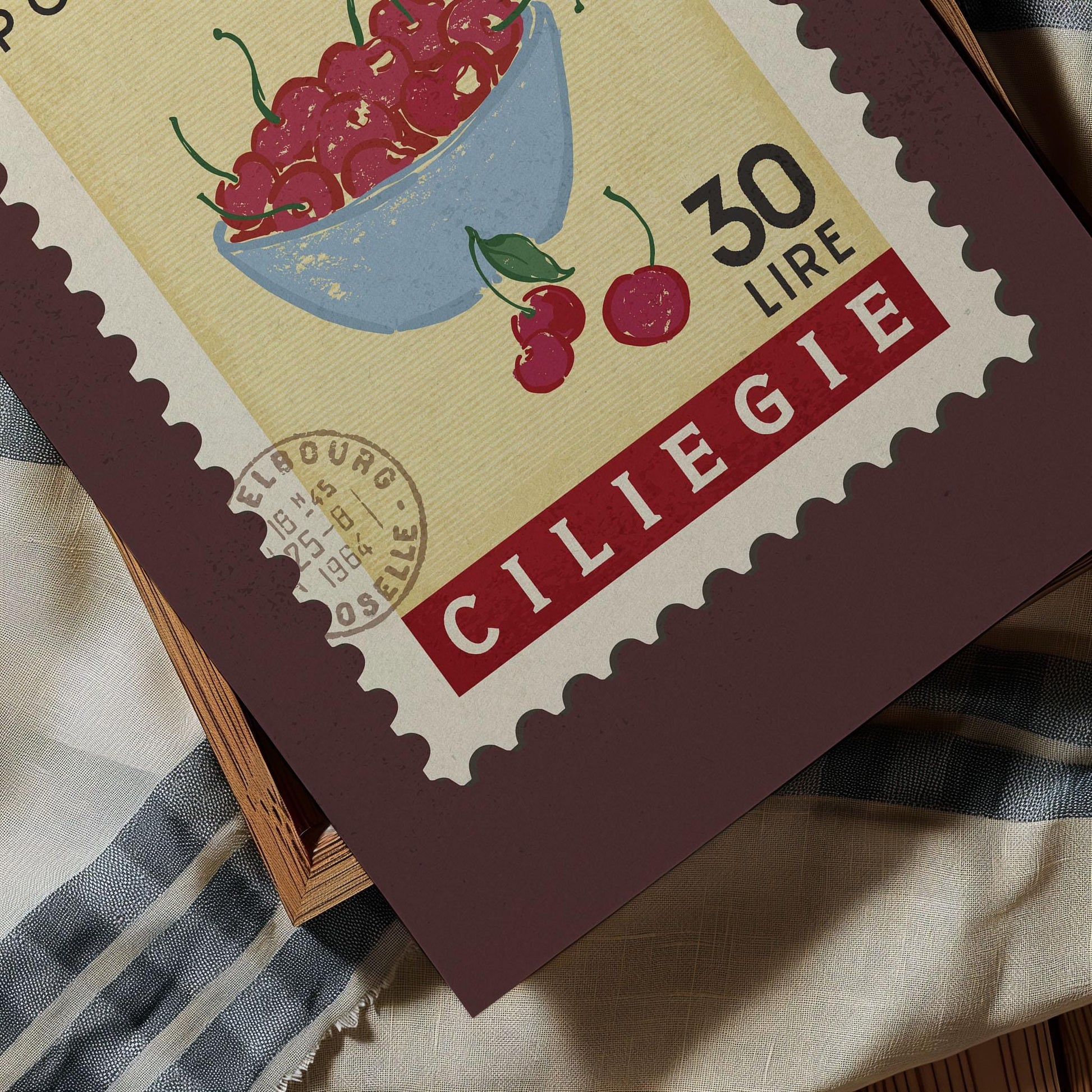 A close-up of a postage stamp featuring a bowl of cherries, with the text &quot;CILIEGIE&quot; and &quot;30 LIRRE&quot; printed on it.