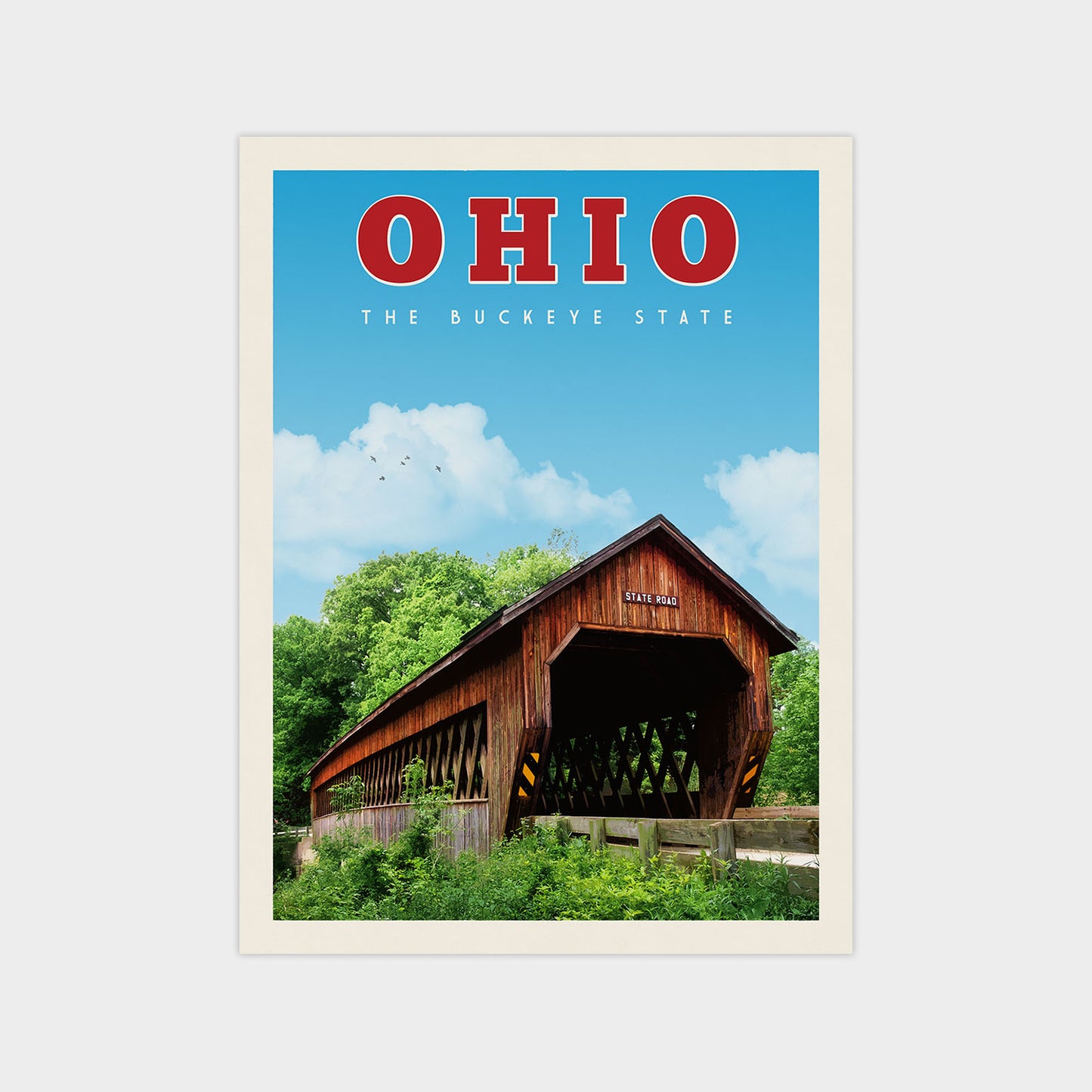 a covered wooden bridge spanning a river, with lush greenery and a clear blue sky in the background.