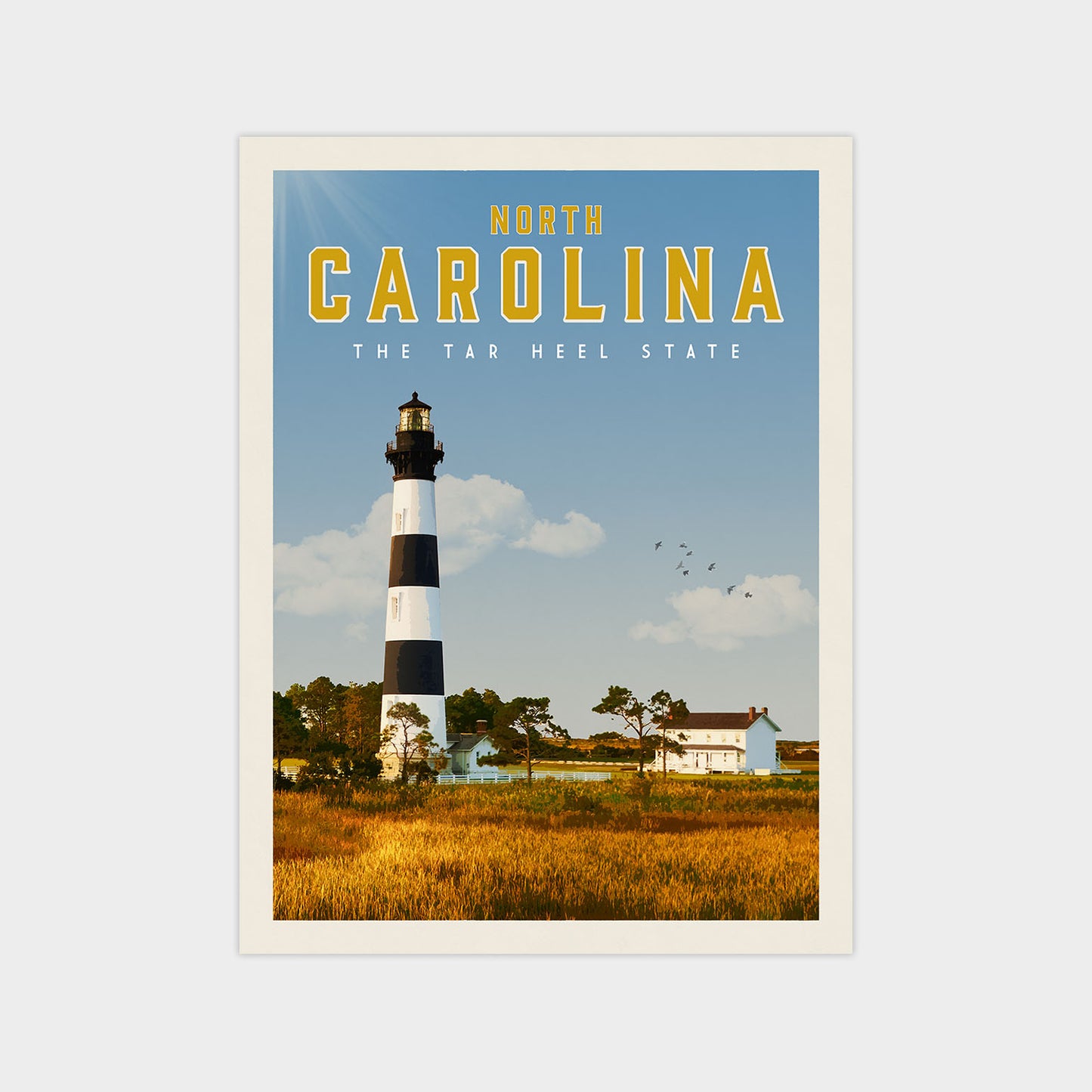 A lighthouse stands tall against a clear blue sky, with a small white house nestled in the distance.